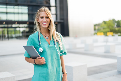 Female doctor, nurse or vet outdoors smiling looking at the camera isolated portrait closeup