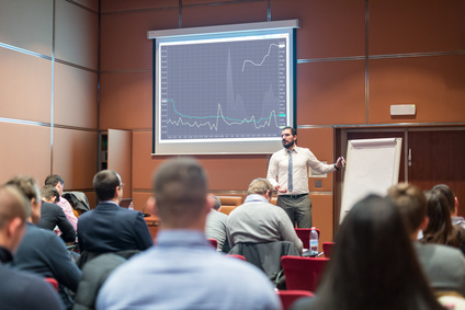 Speaker Giving a Talk at Business Meeting.