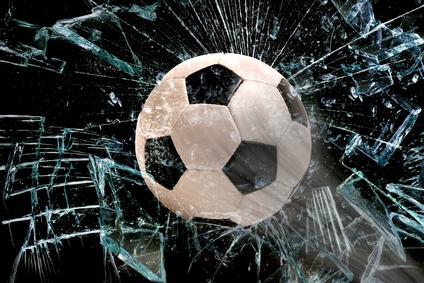 Soccer ball through glass.